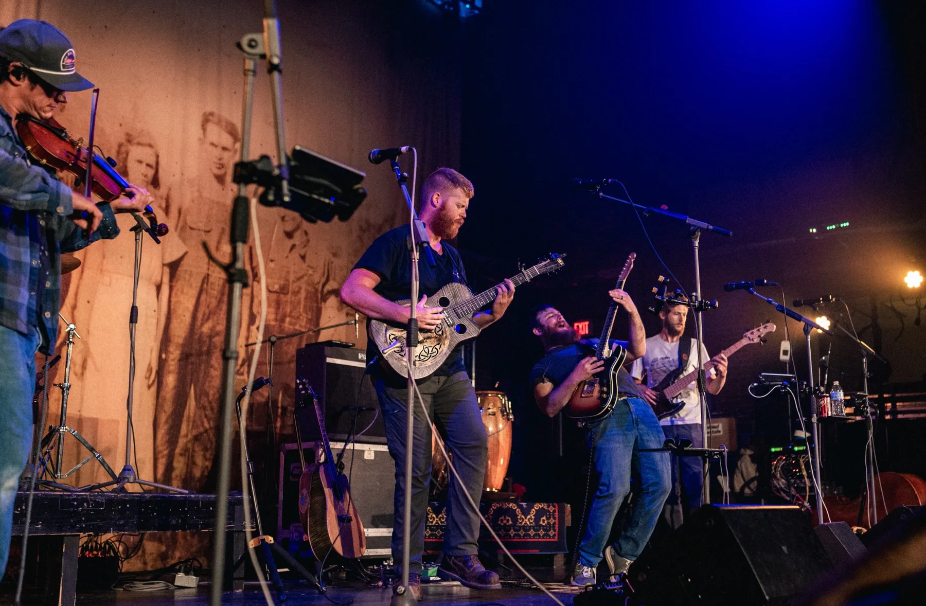 Musicians performing together on stage